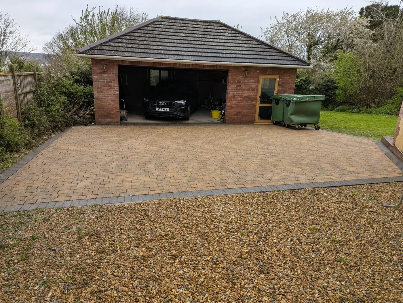 Block paving driveway gleaming after professional driveway cleaning